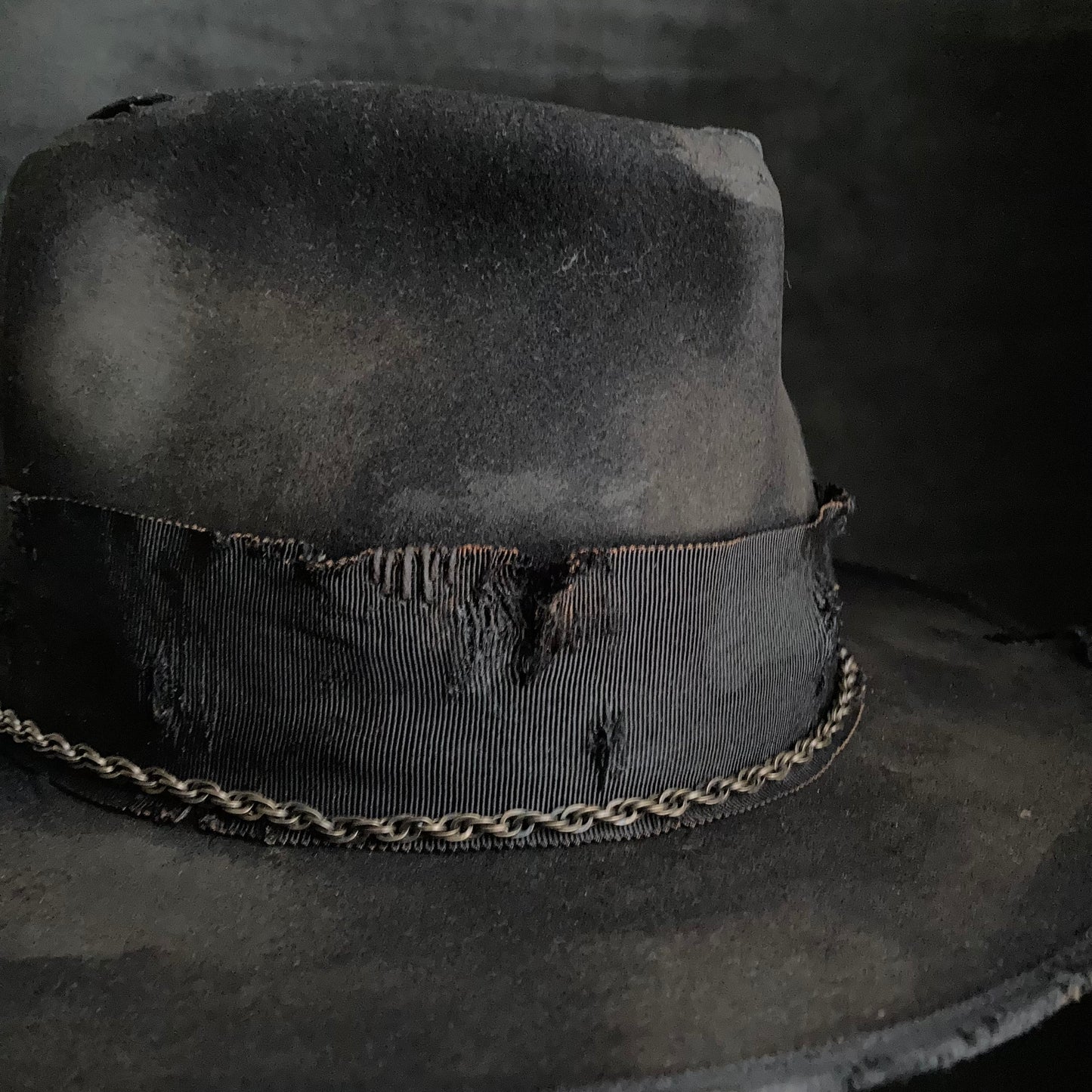 Damaged black rabbit fedora