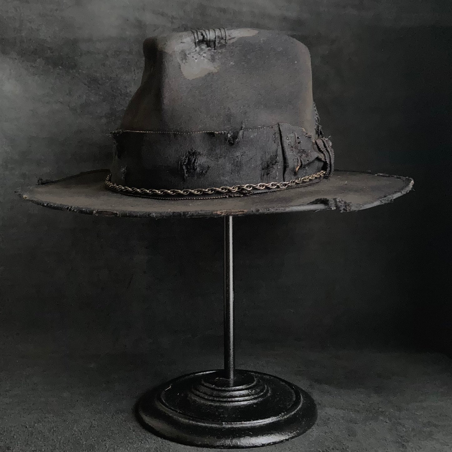 Damaged black rabbit fedora