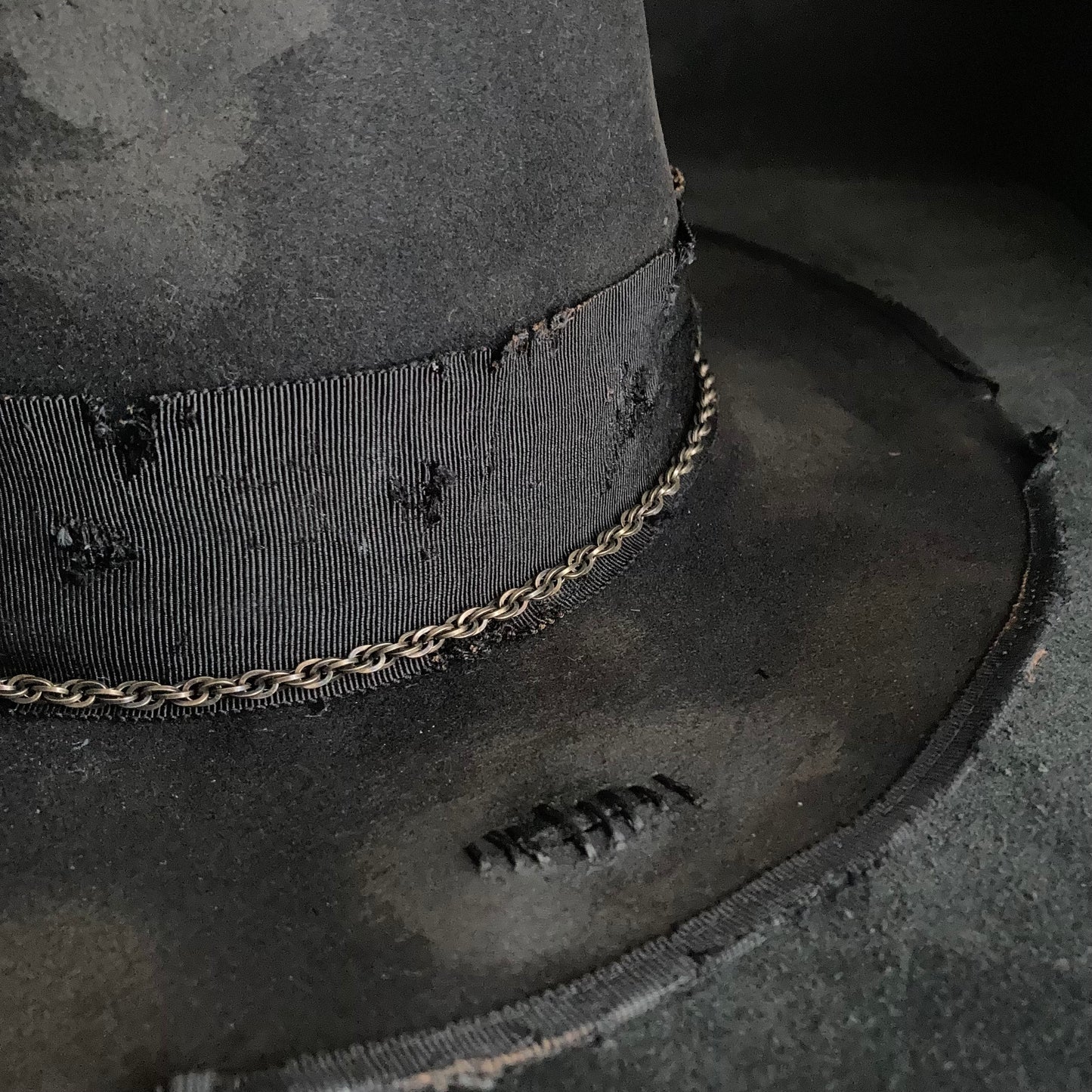 Damaged black rabbit fedora