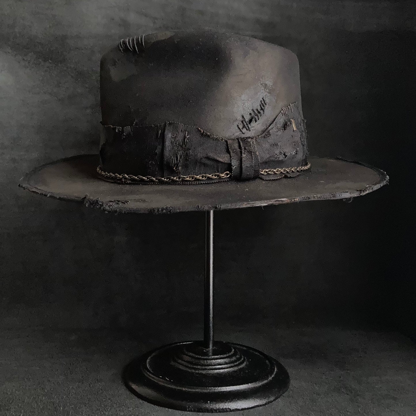 Damaged black rabbit fedora