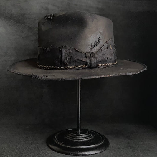 Damaged black rabbit fedora