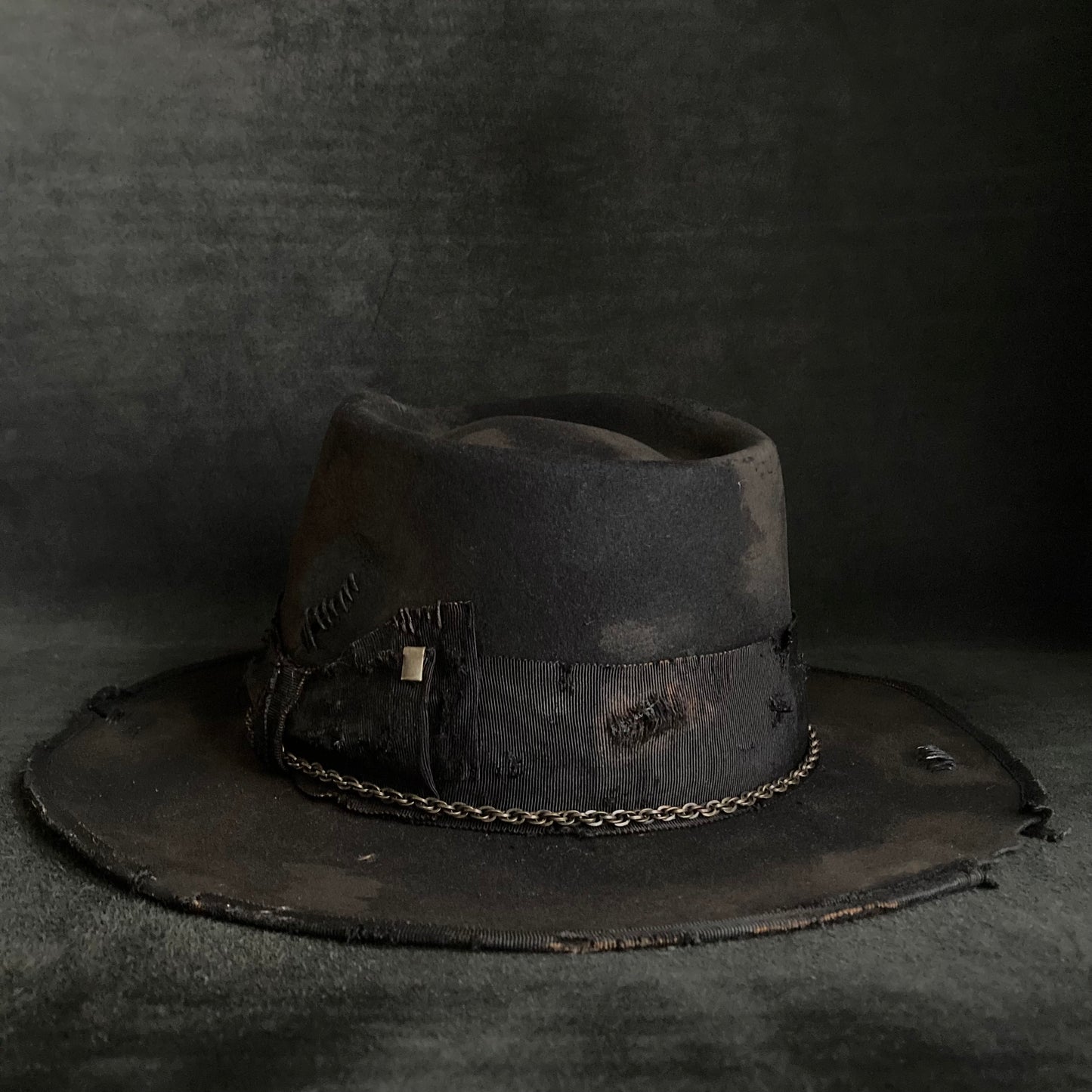 Damaged black rabbit fedora