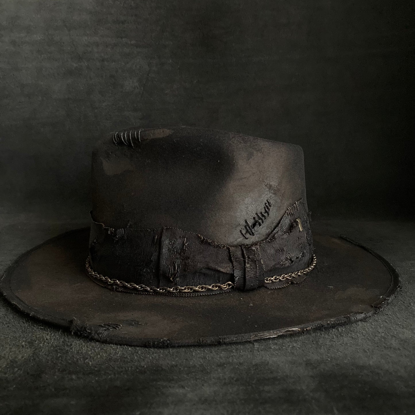 Damaged black rabbit fedora