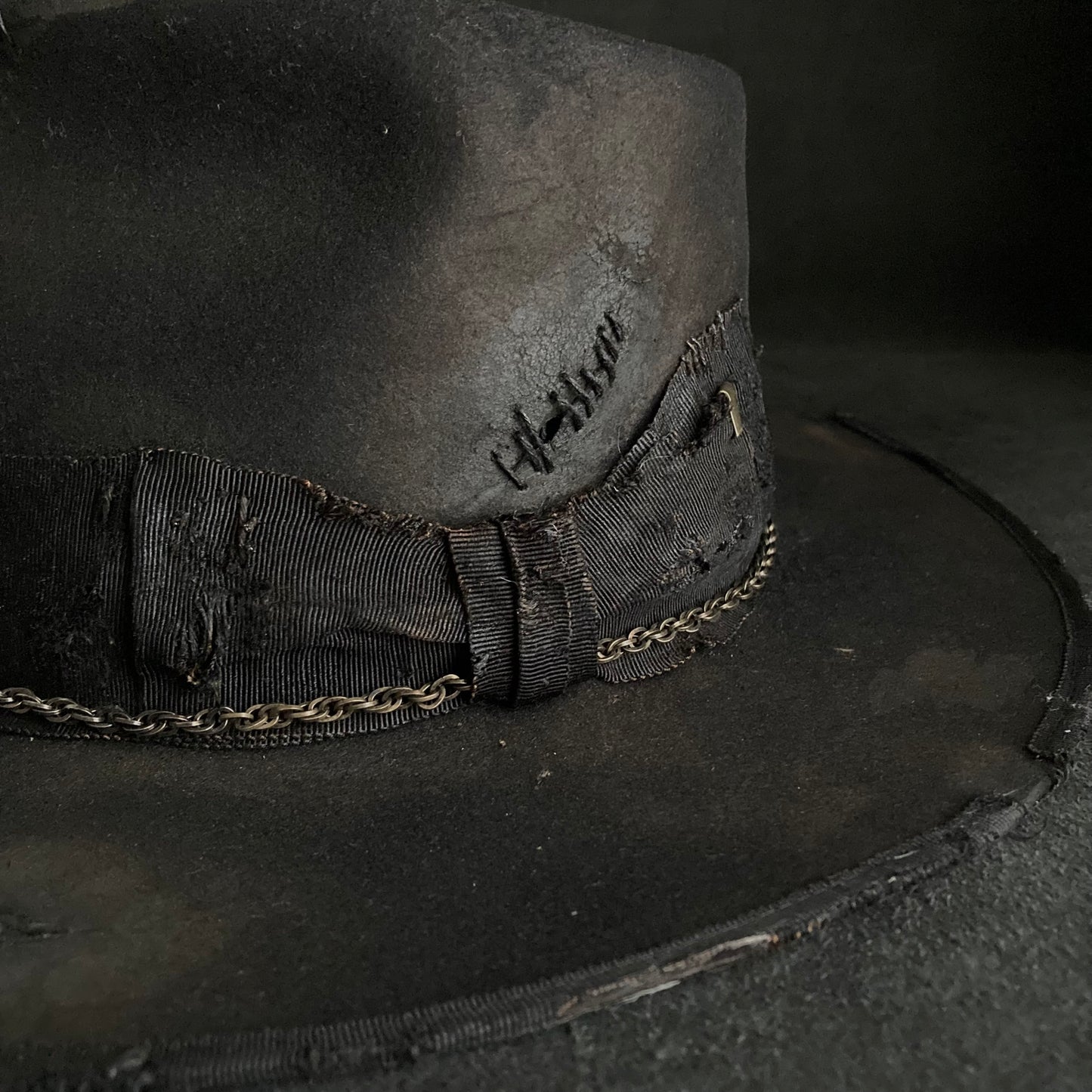 Damaged black rabbit fedora