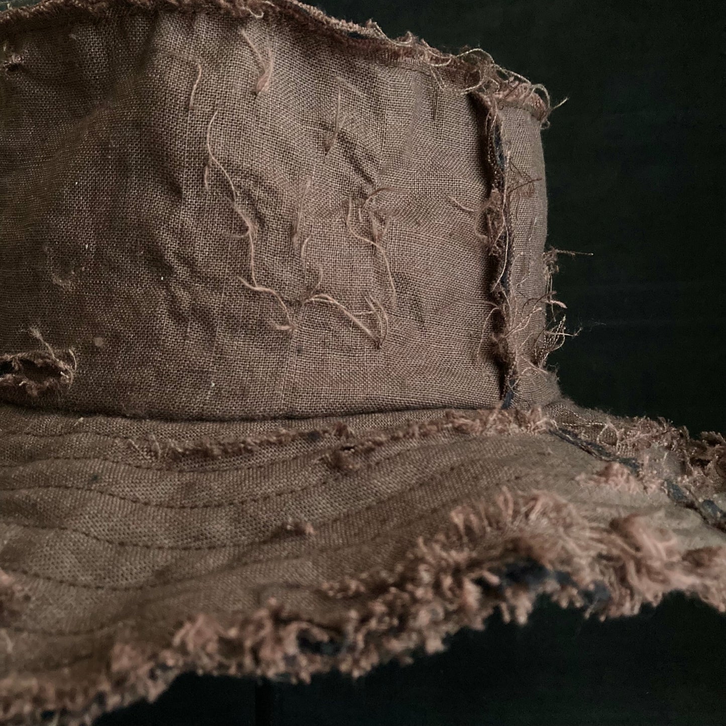 Back side brown linen damage bucket hat