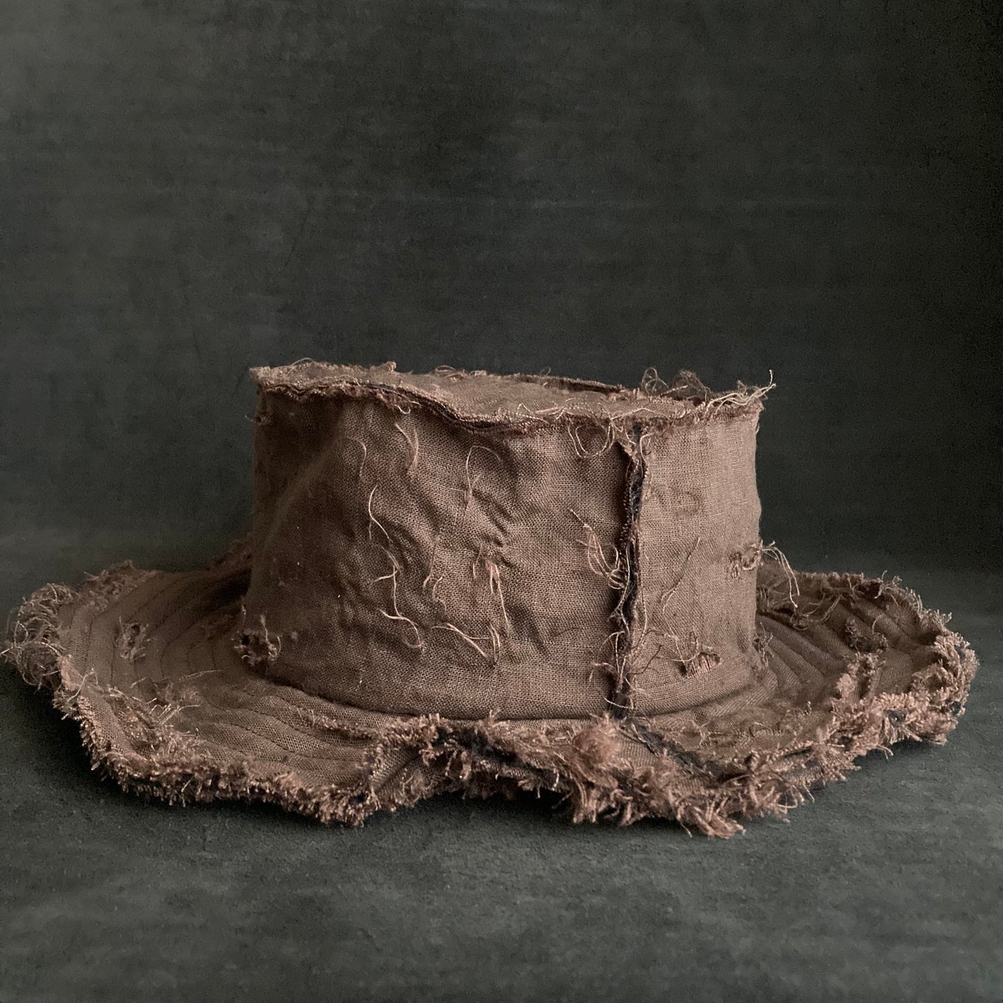 Back side brown linen damage bucket hat