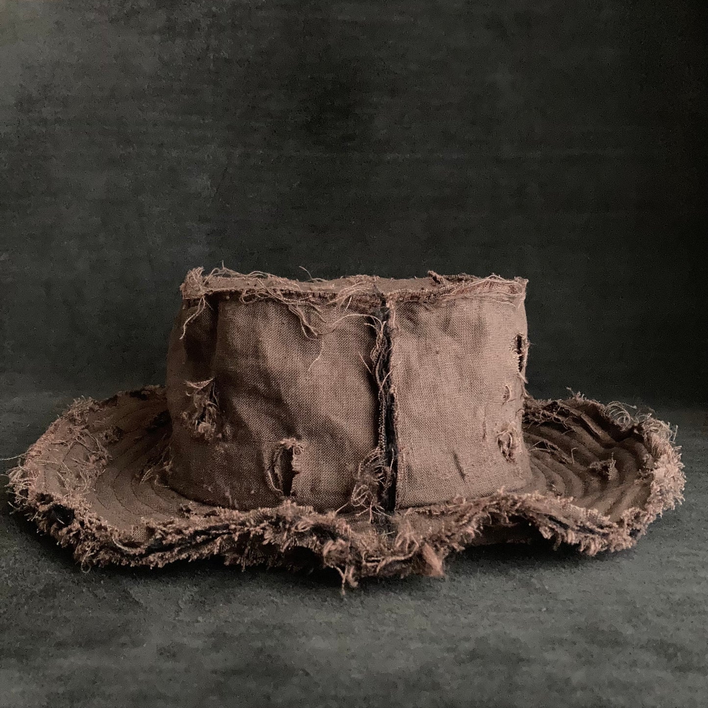 Back side brown linen damage bucket hat