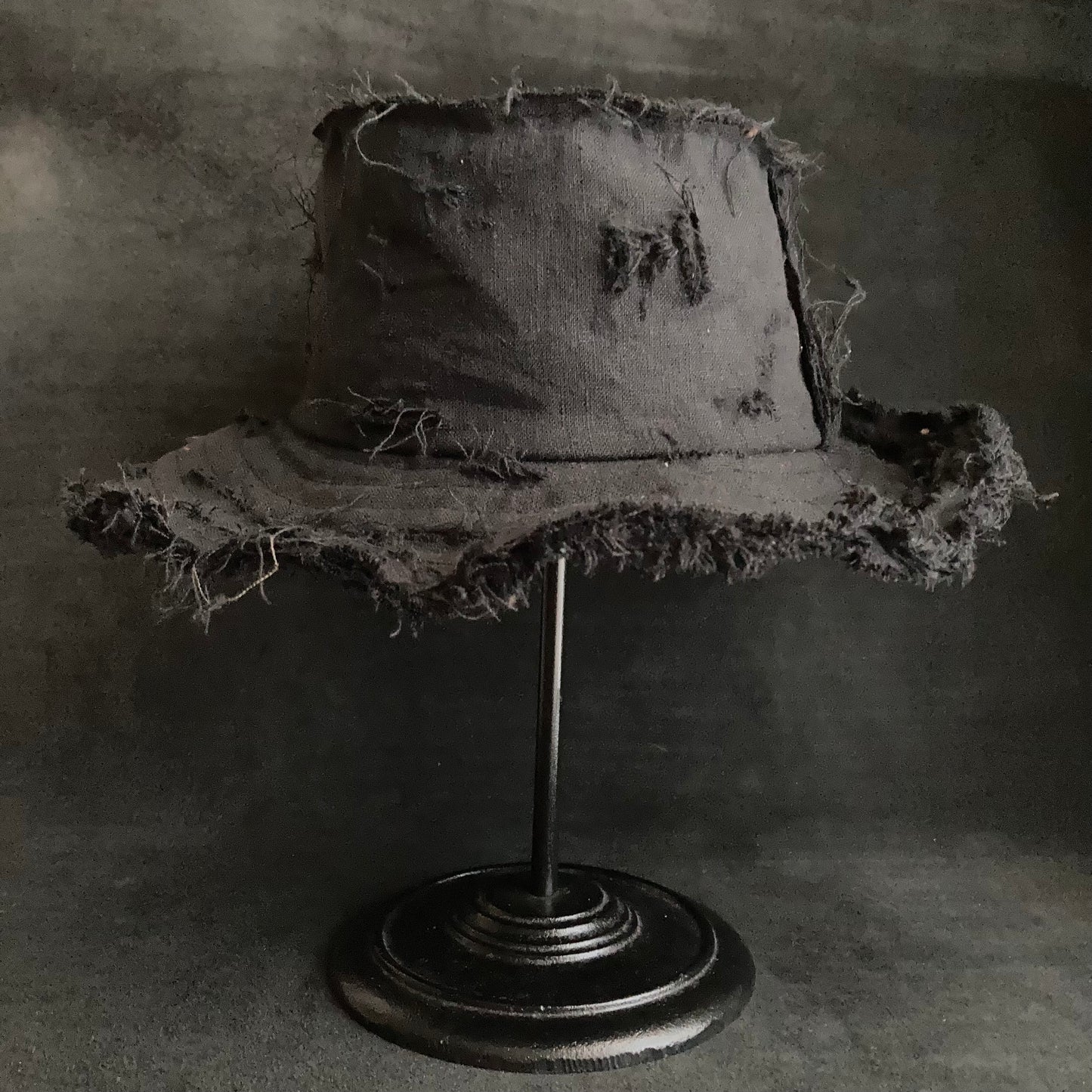 Back side black linen damage bucket hat