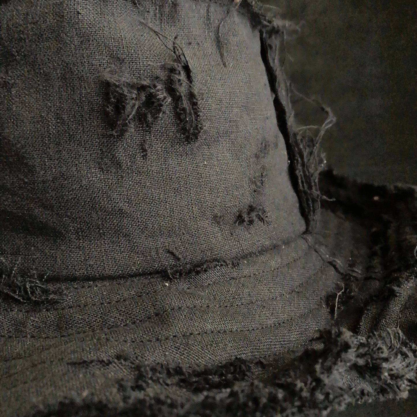 Back side black linen damage bucket hat