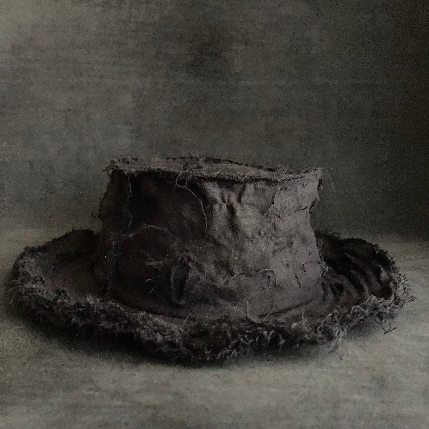 Back side black linen damage bucket hat