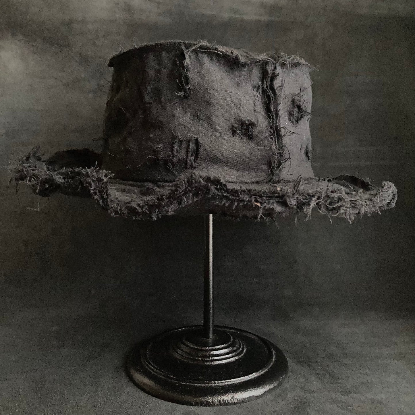 Back side black linen damage bucket hat