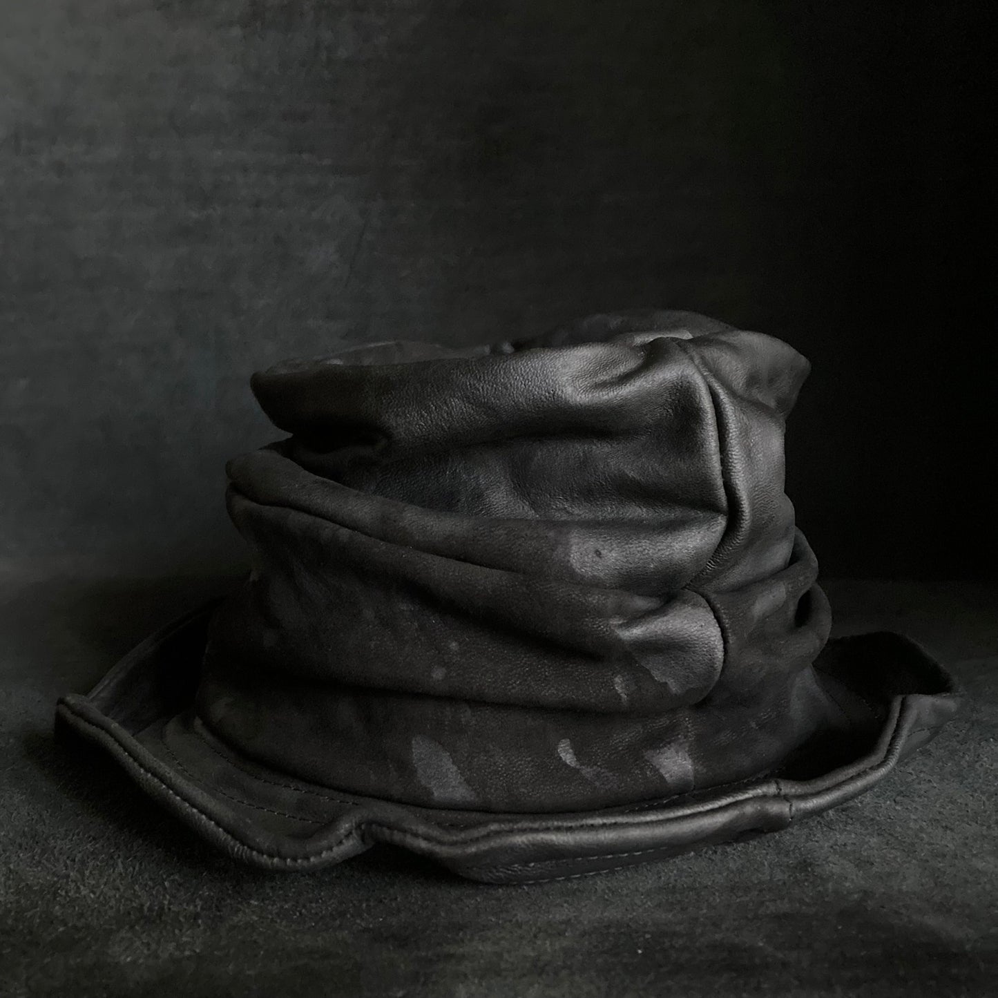 Bleached black leather turn bucket hat