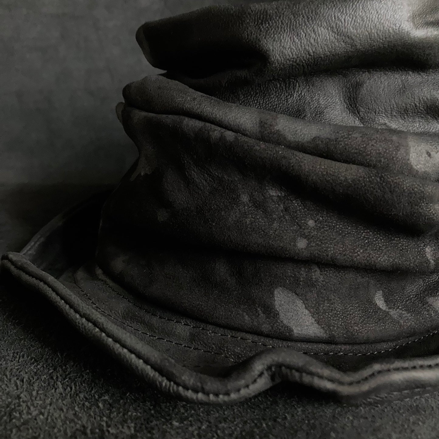 Bleached black leather turn bucket hat