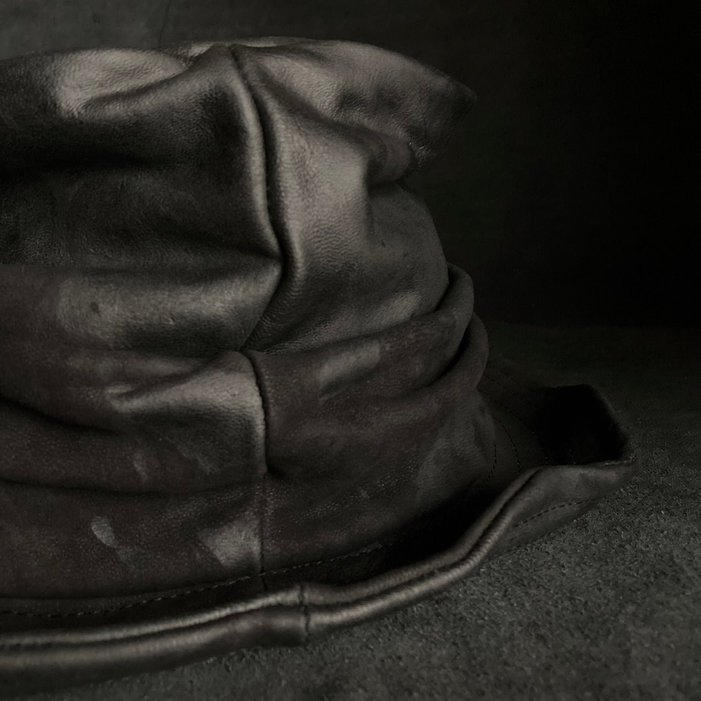 Bleached black leather turn bucket hat