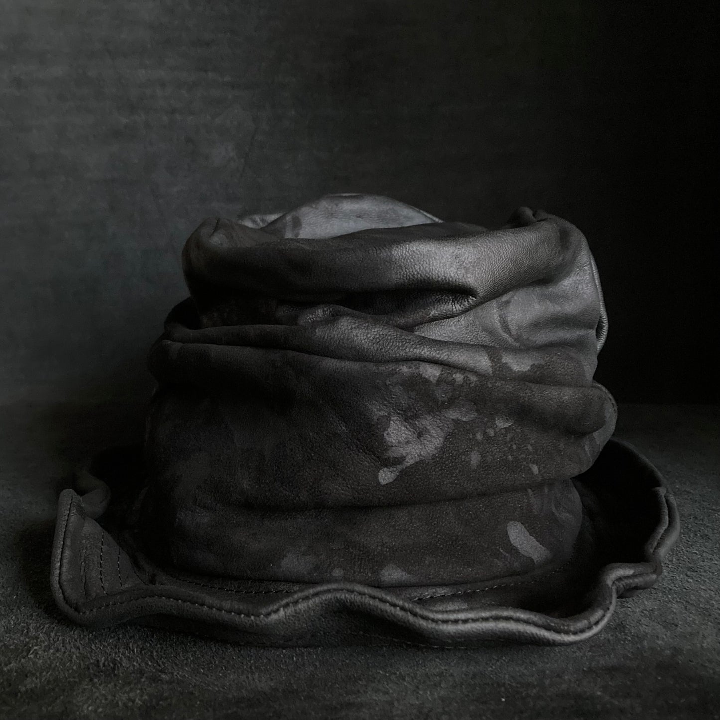 Bleached black leather turn bucket hat