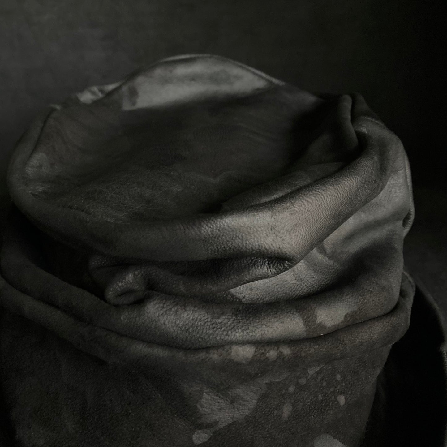 Bleached black leather turn bucket hat