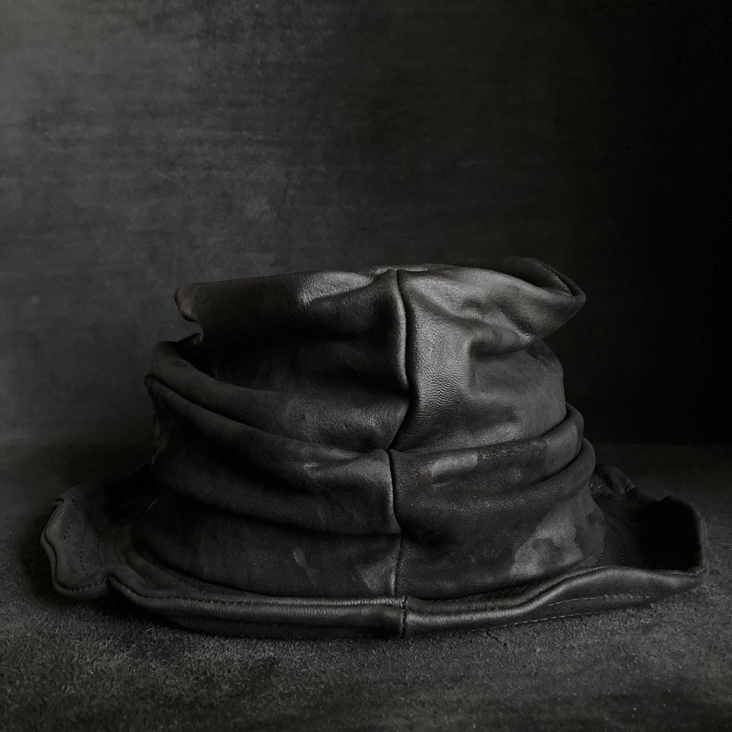 Bleached black leather turn bucket hat