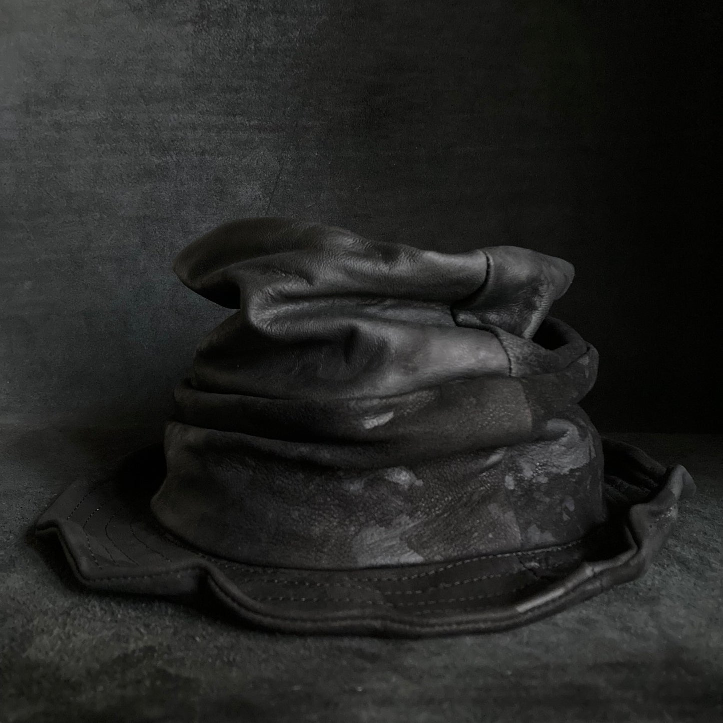 Bleached black leather turn bucket hat