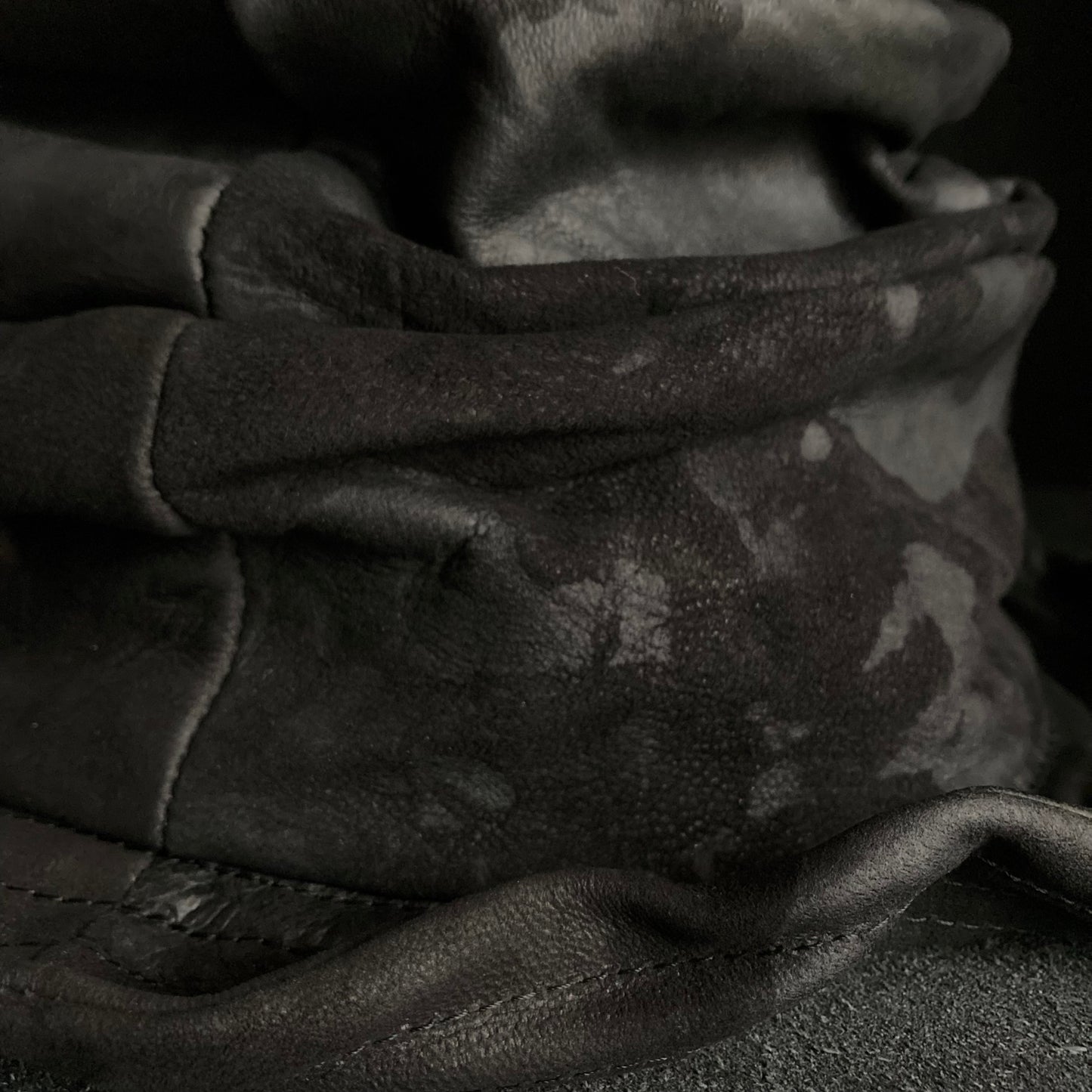 Bleached black leather turn bucket hat