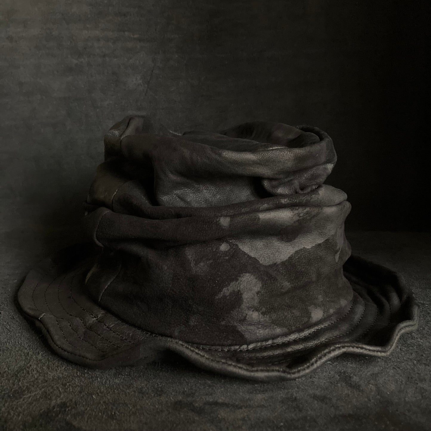 Bleached black leather turn bucket hat