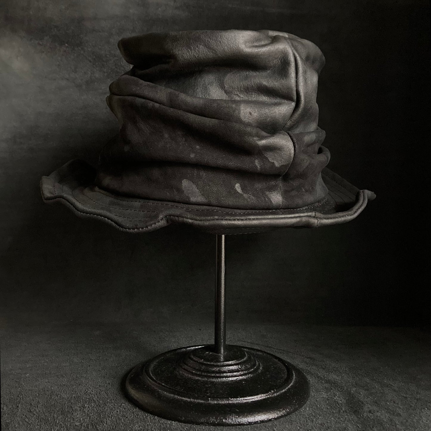 Bleached black leather turn bucket hat