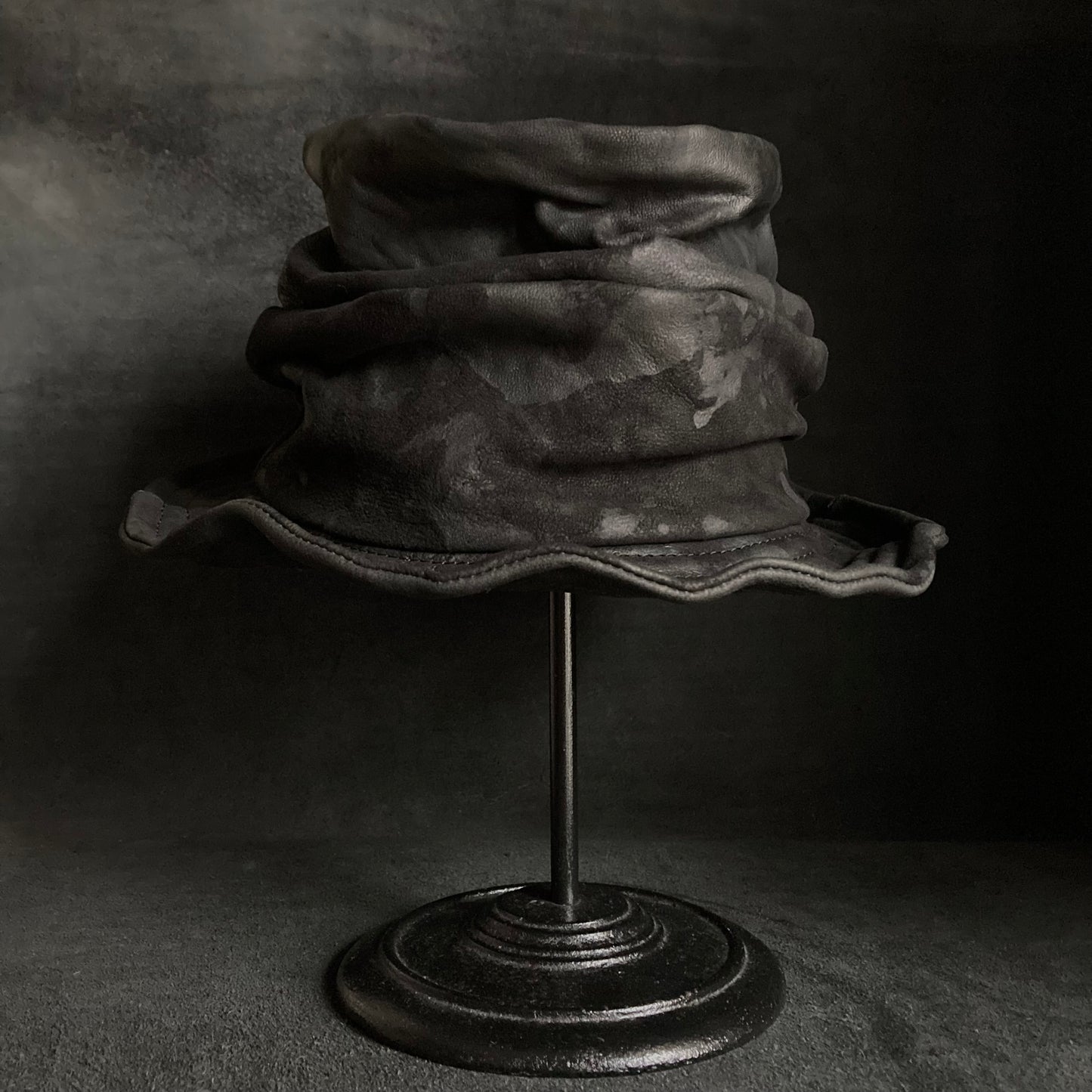 Bleached black leather turn bucket hat
