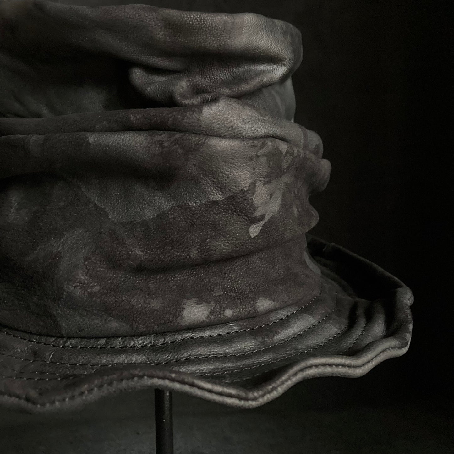 Bleached black leather turn bucket hat