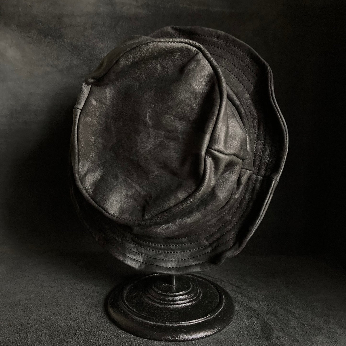 Bleached black leather turn bucket hat