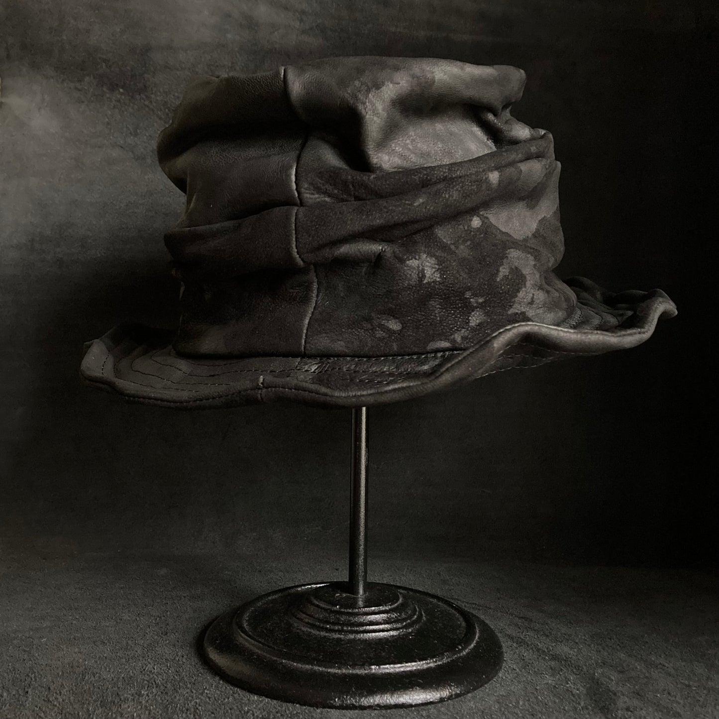 Bleached black leather turn bucket hat