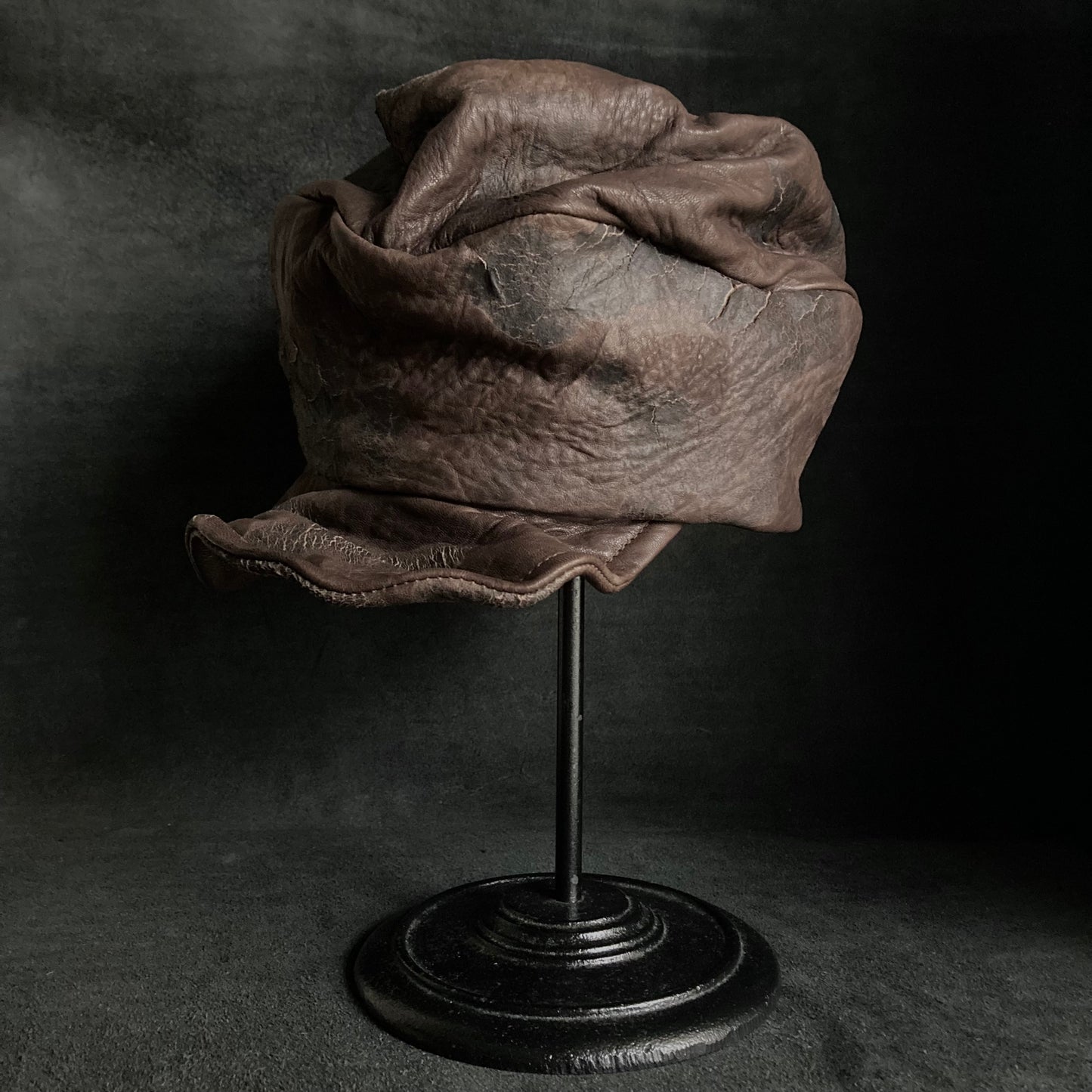 Cracked dark brown leather turn cap