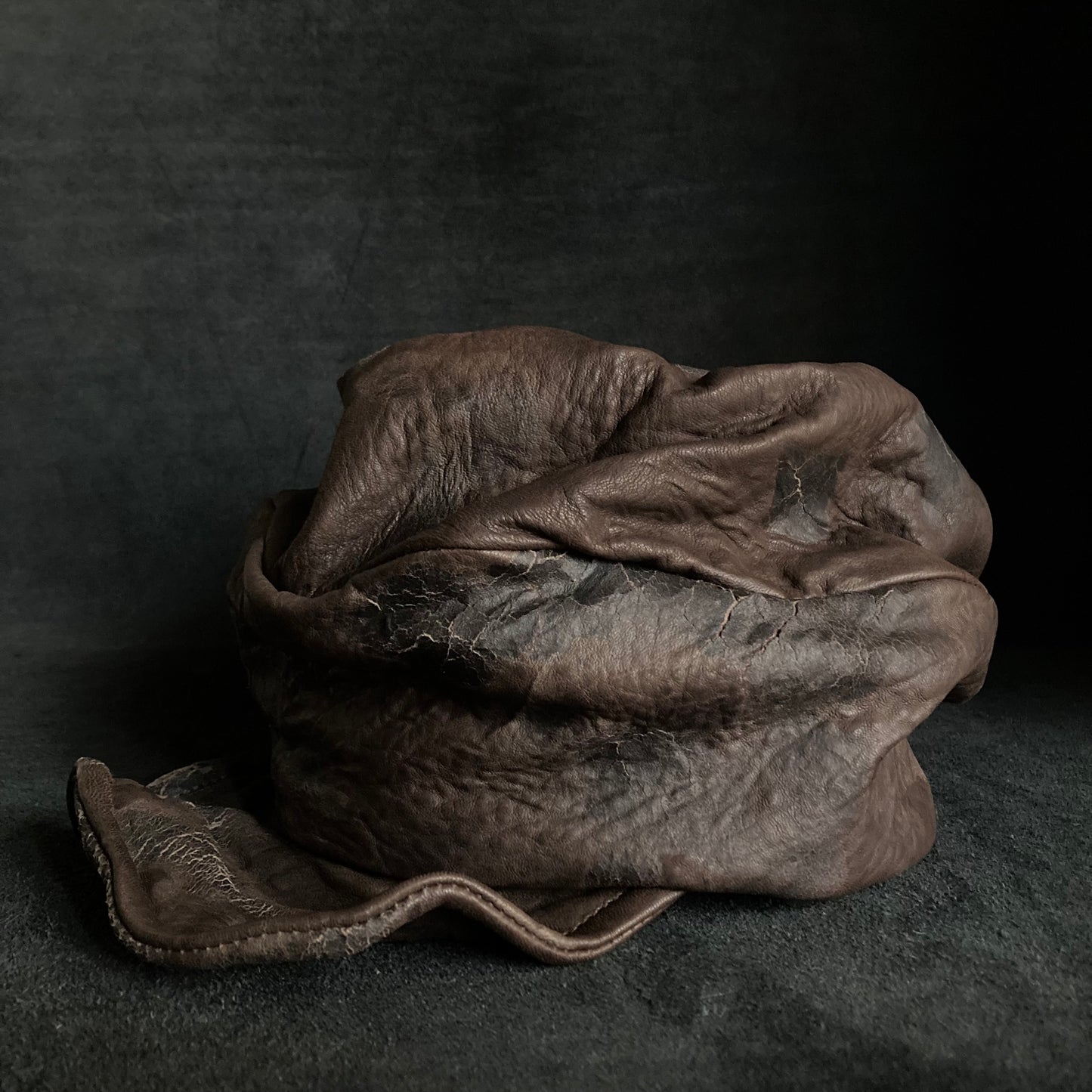 Cracked dark brown leather turn cap