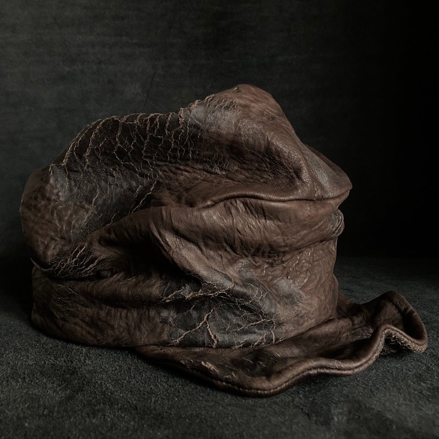 Cracked dark brown leather turn cap