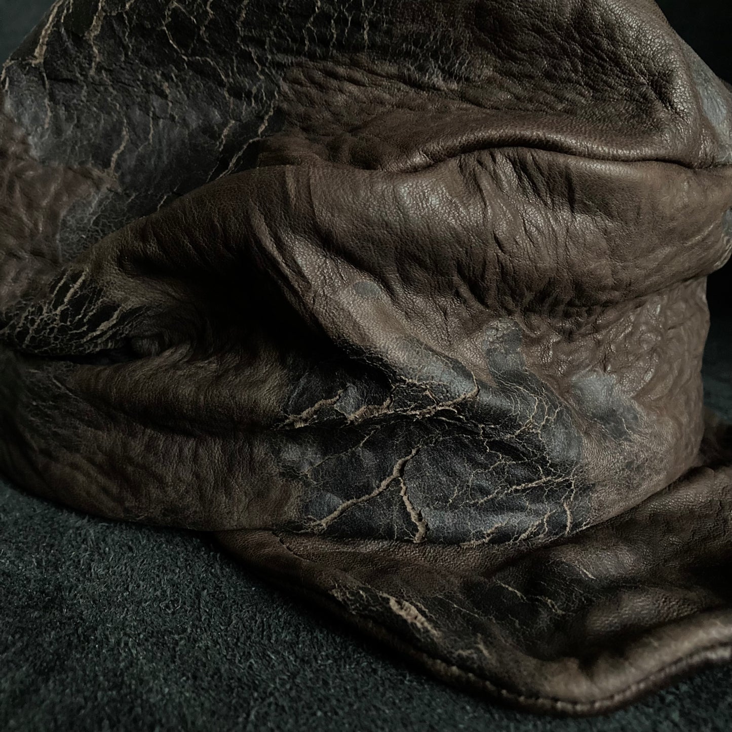 Cracked dark brown leather turn cap