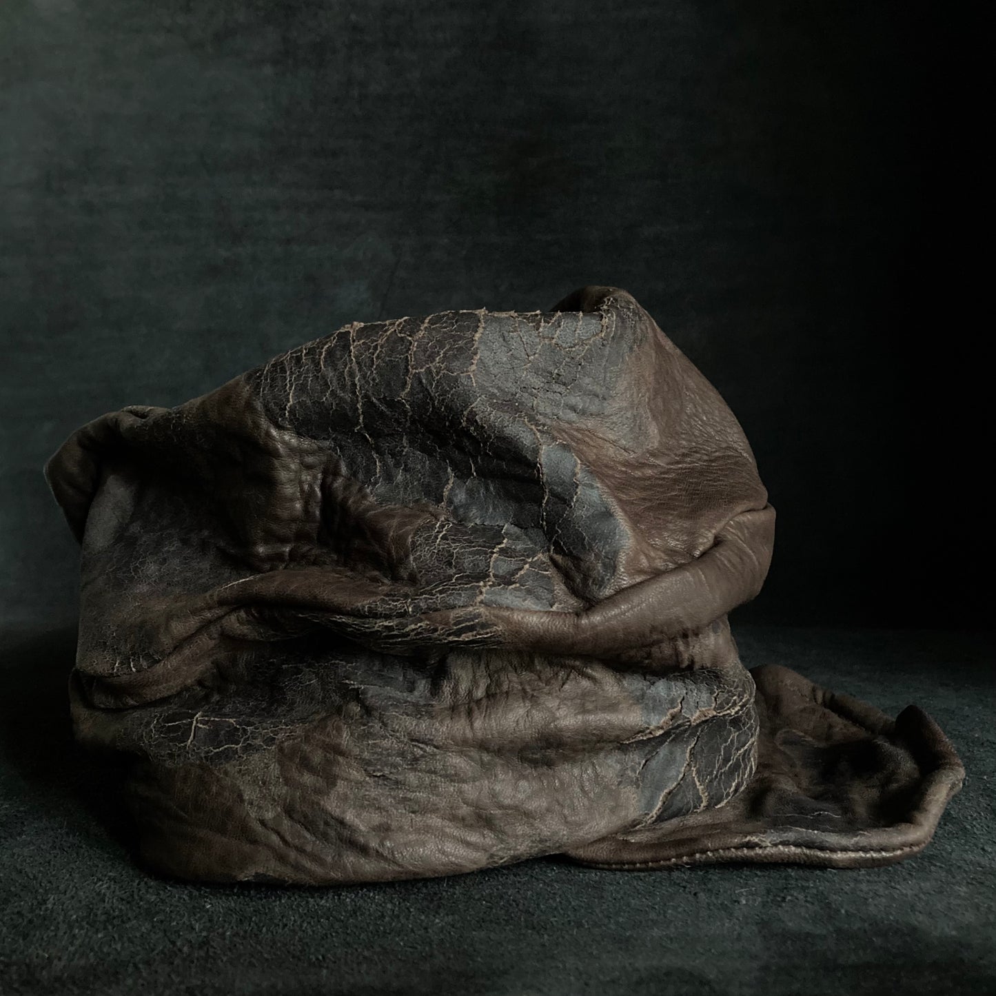 Cracked dark brown leather turn cap