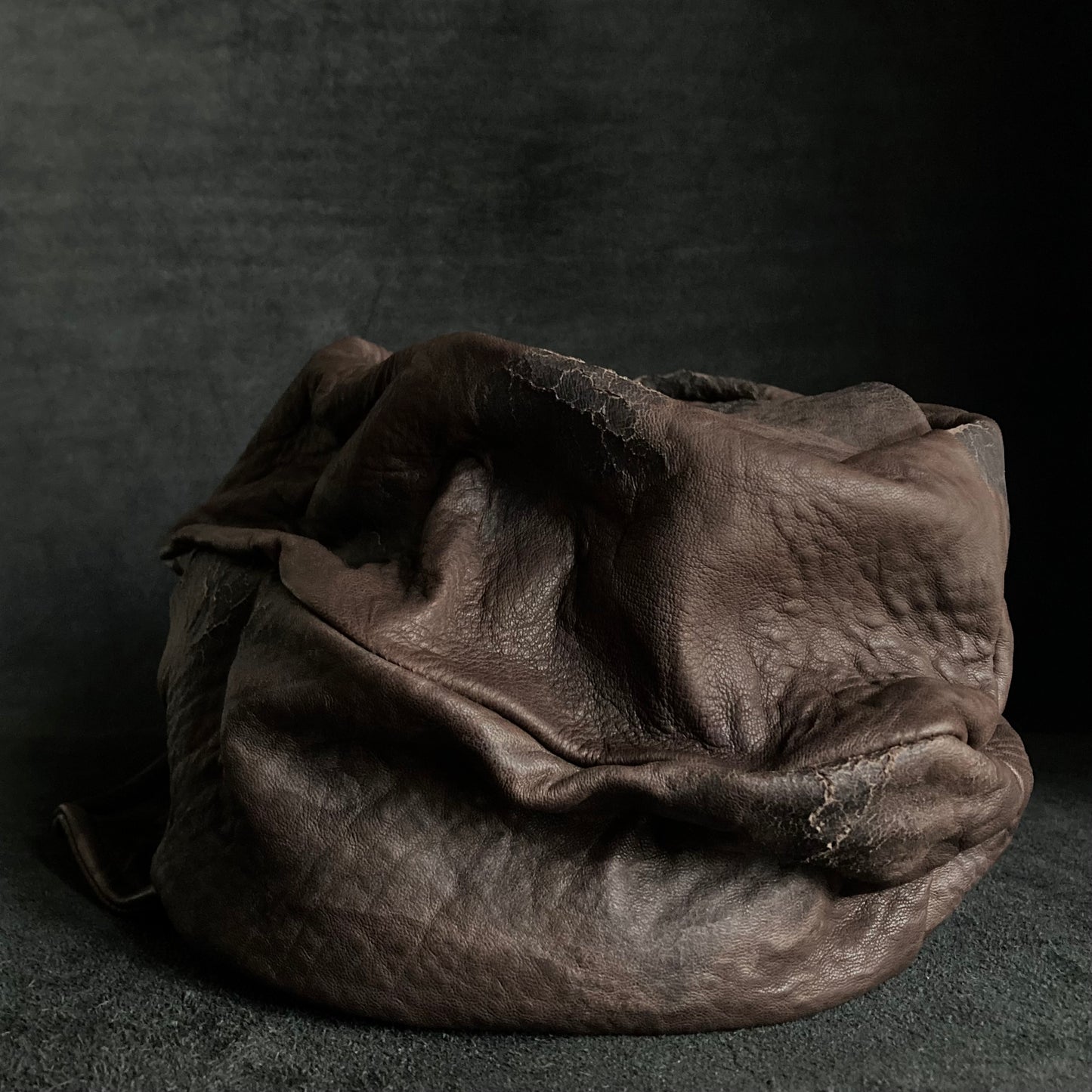 Cracked dark brown leather turn cap