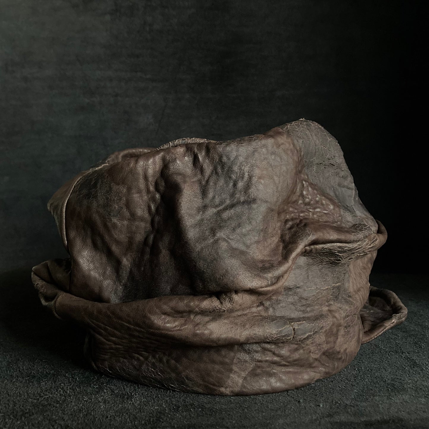 Cracked dark brown leather turn cap