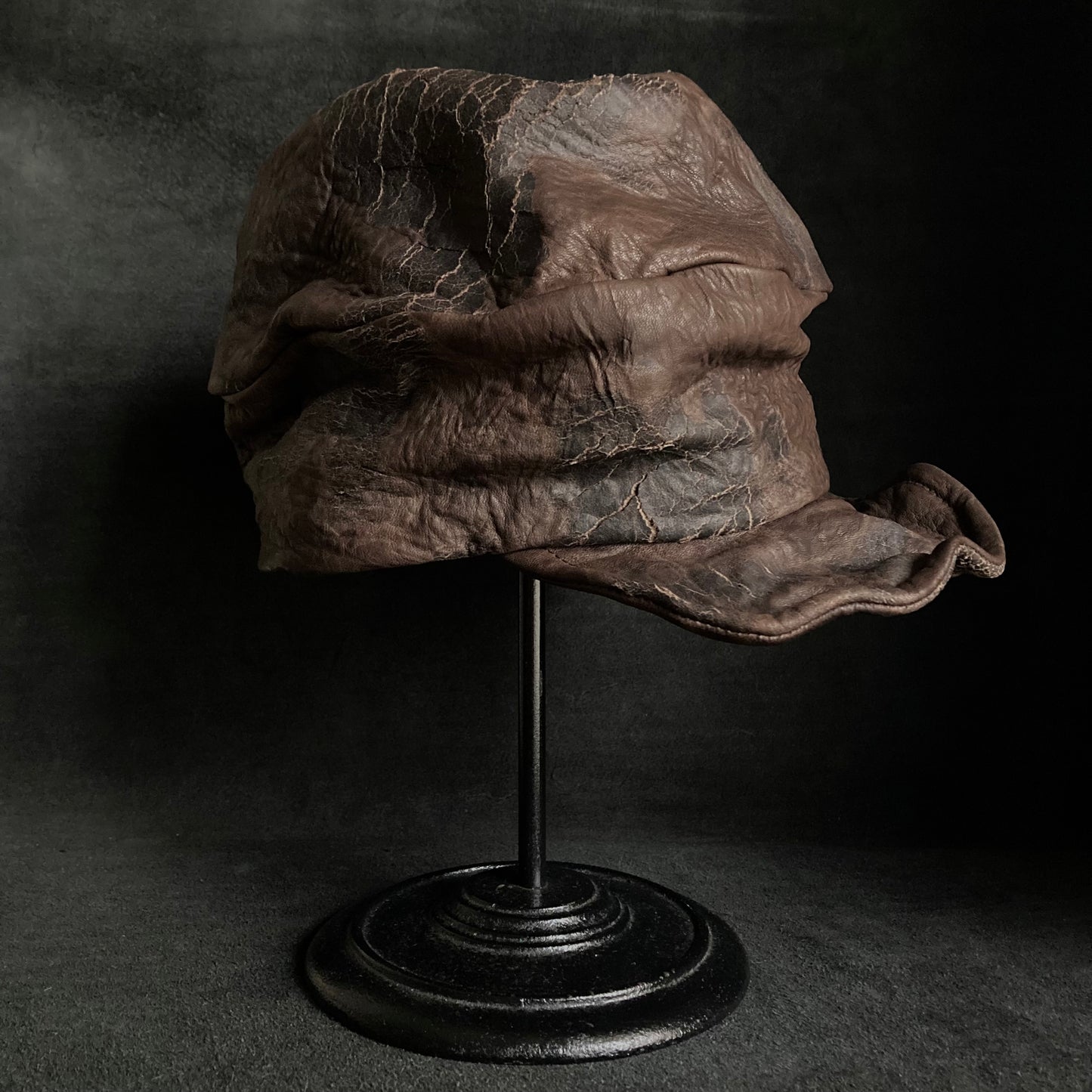 Cracked dark brown leather turn cap