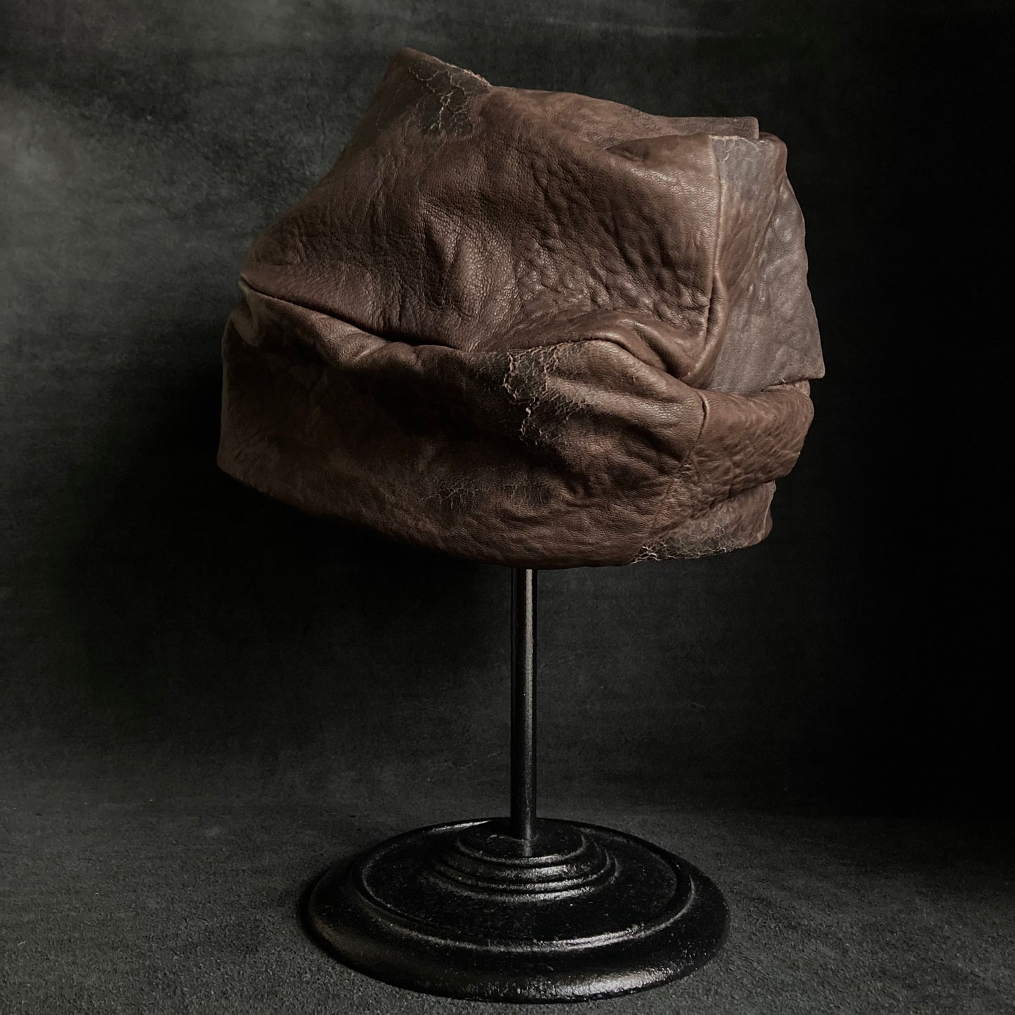 Cracked dark brown leather turn cap