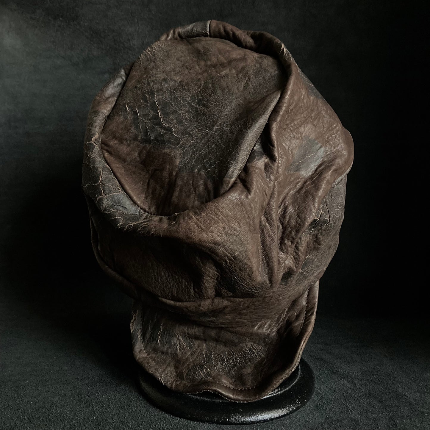 Cracked dark brown leather turn cap