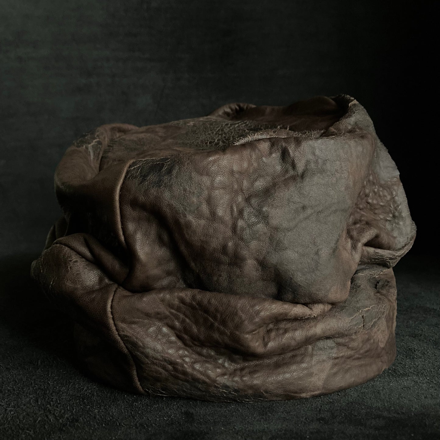 Cracked dark brown leather turn cap