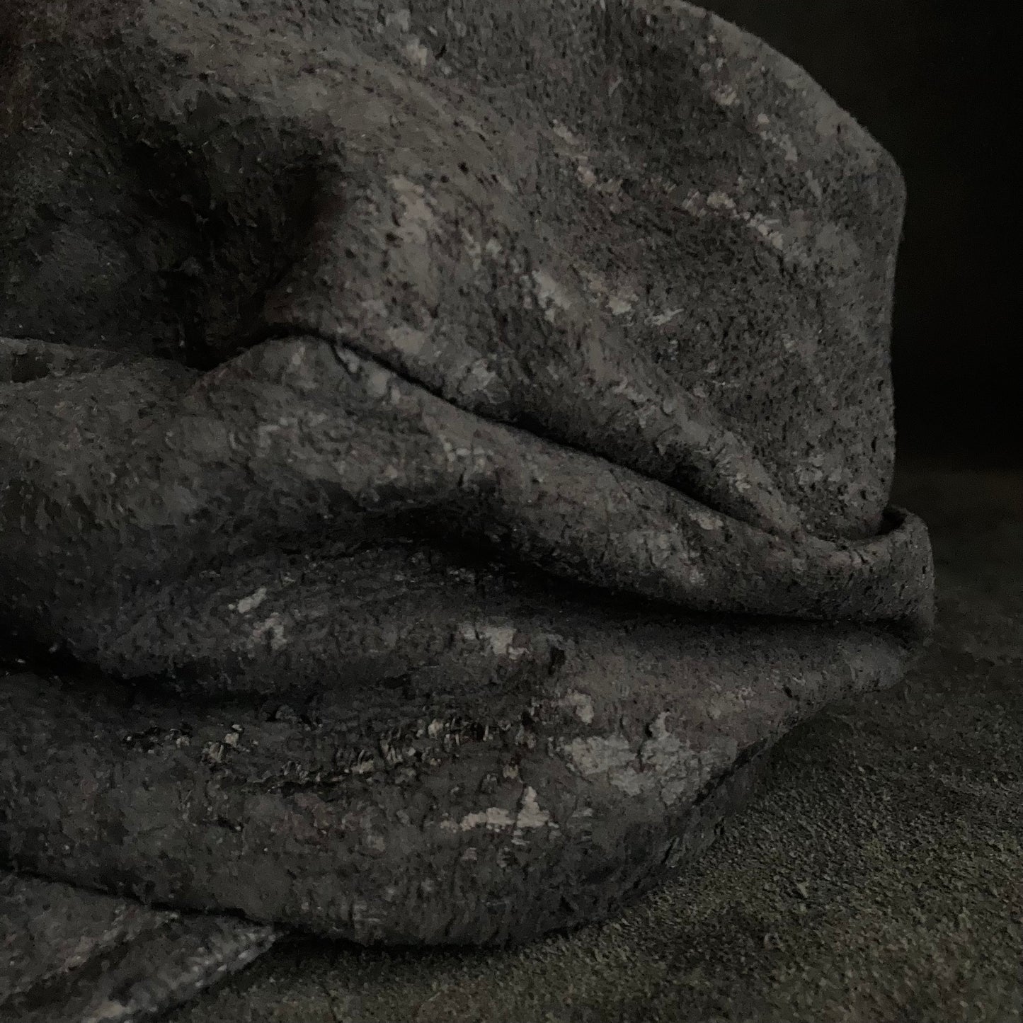 Scrape black leather turn cap