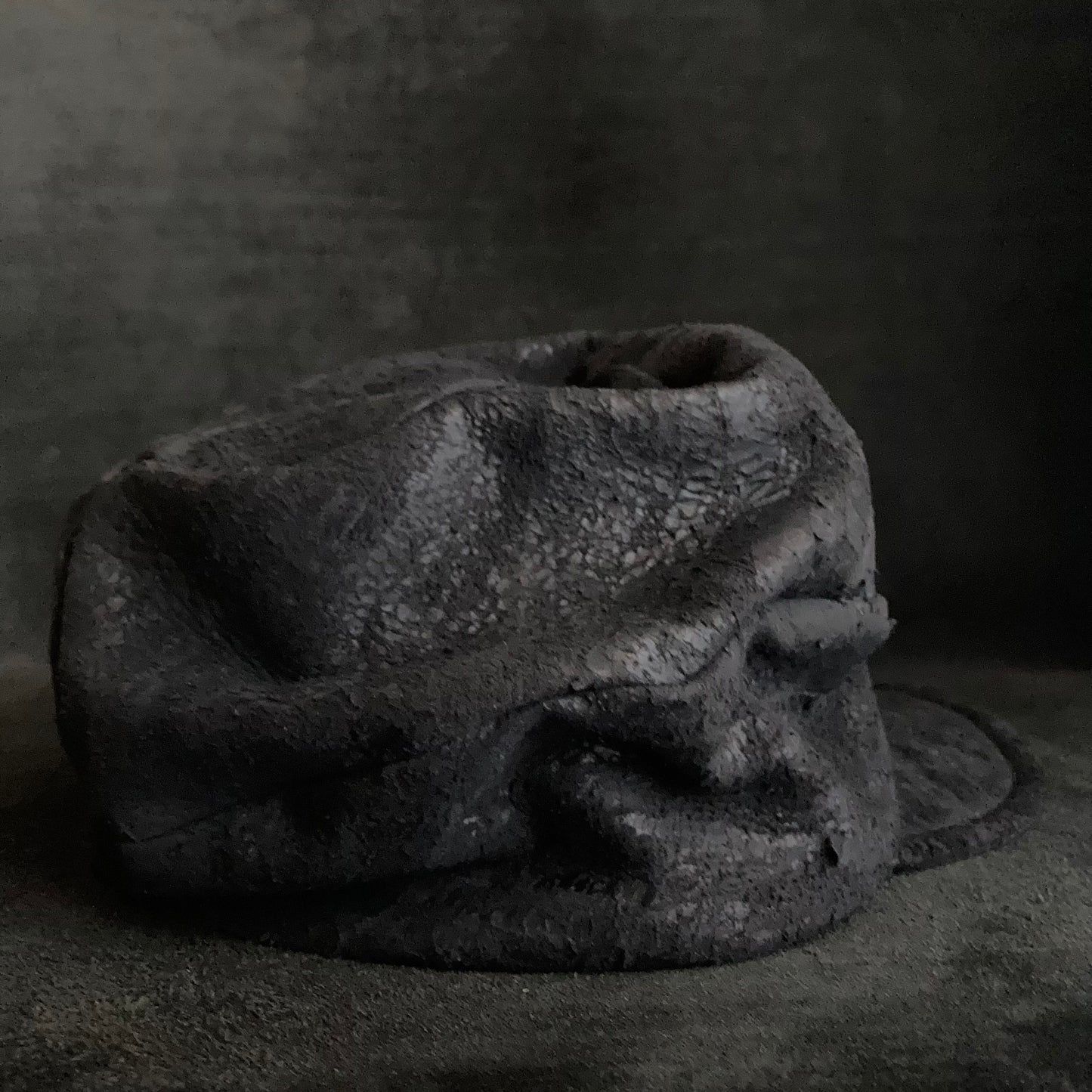 Scrape black leather turn cap