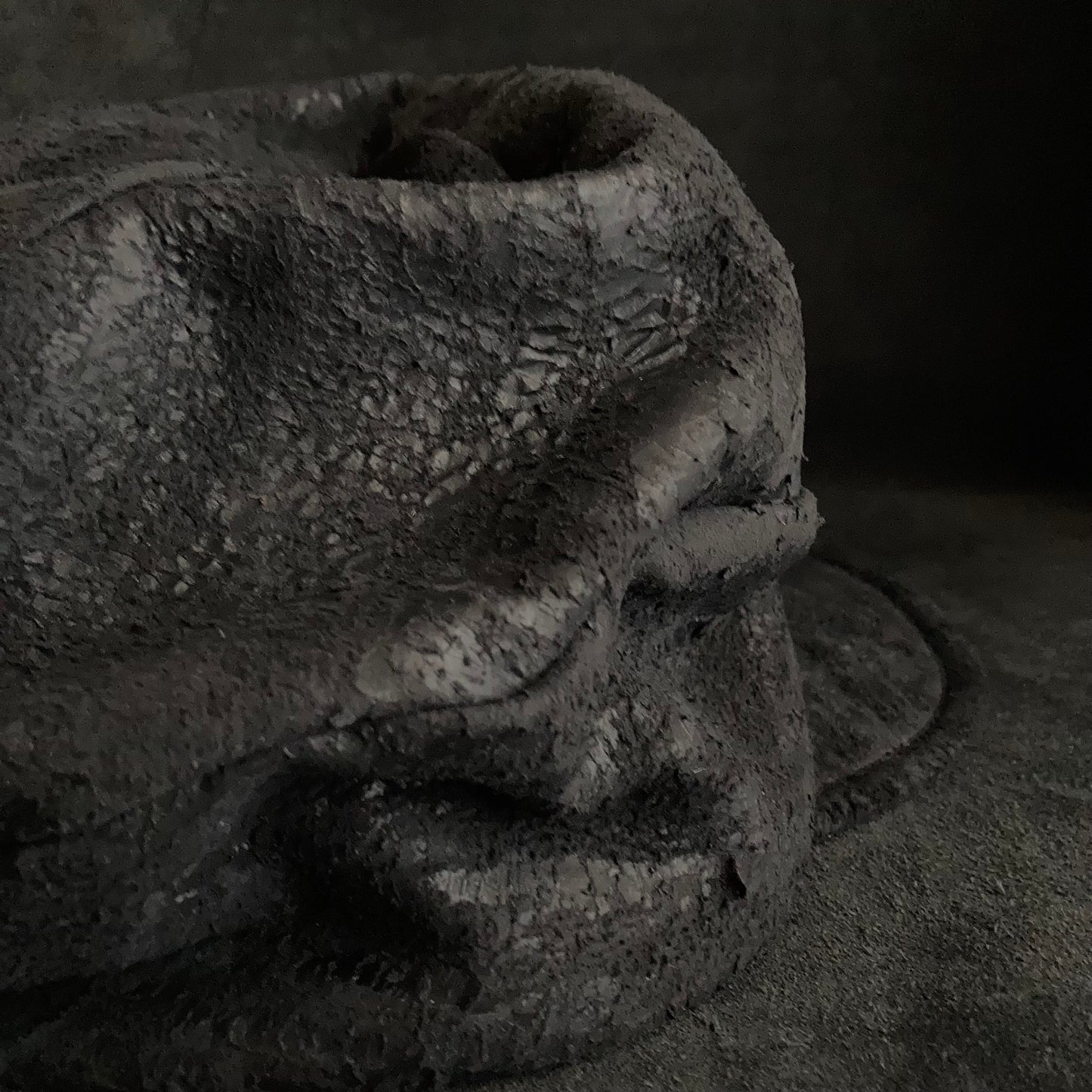 Scrape black leather turn cap