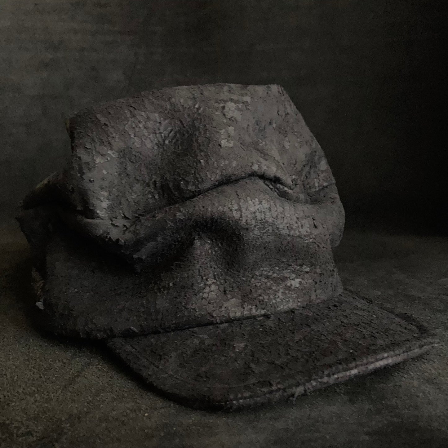 Scrape black leather turn cap