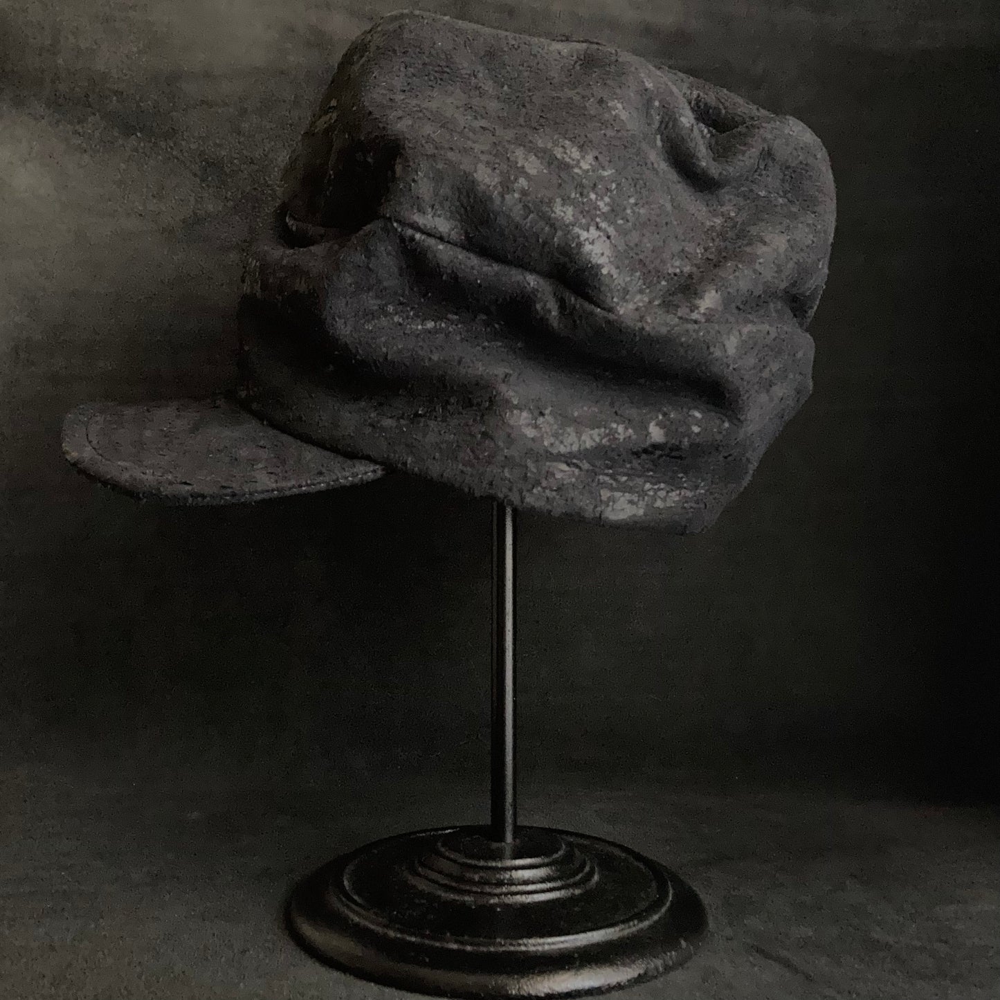 Scrape black leather turn cap