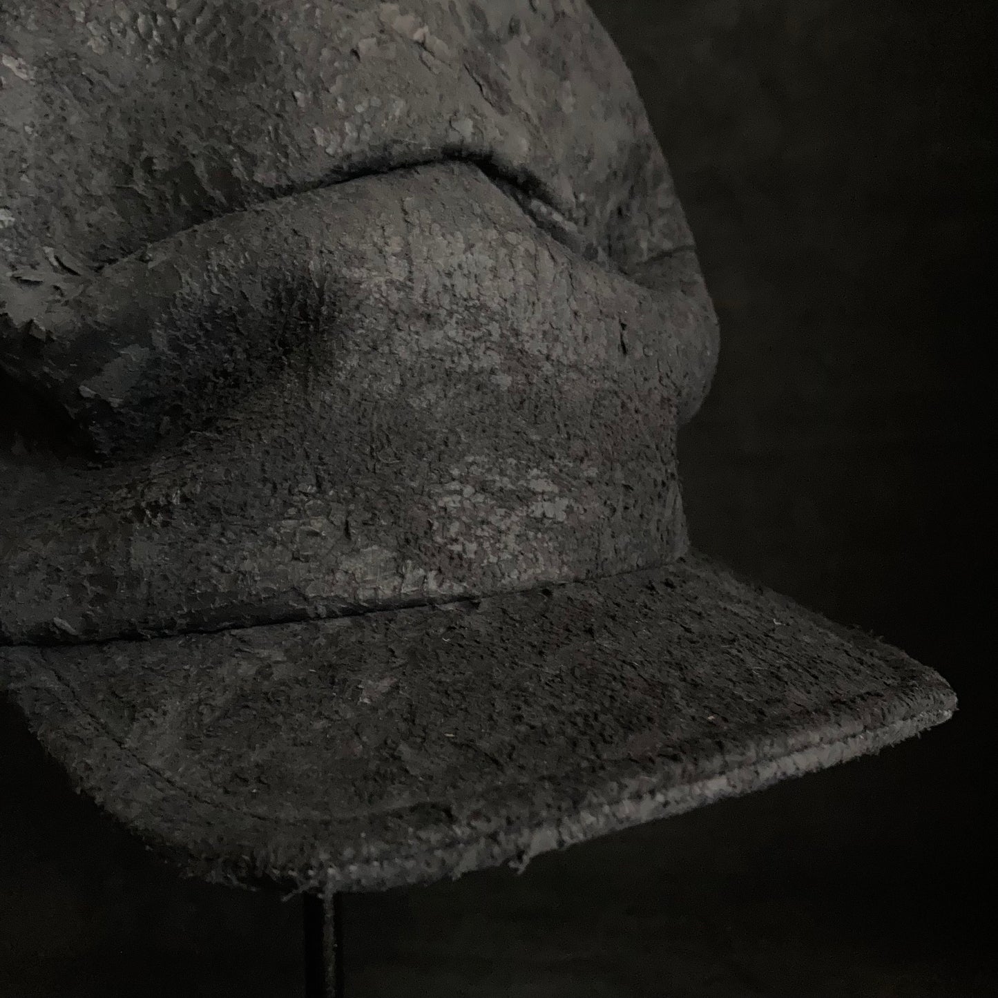 Scrape black leather turn cap