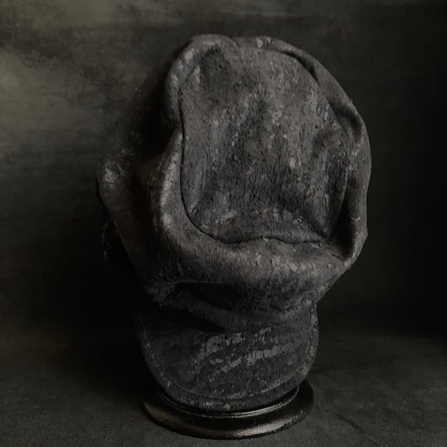 Scrape black leather turn cap