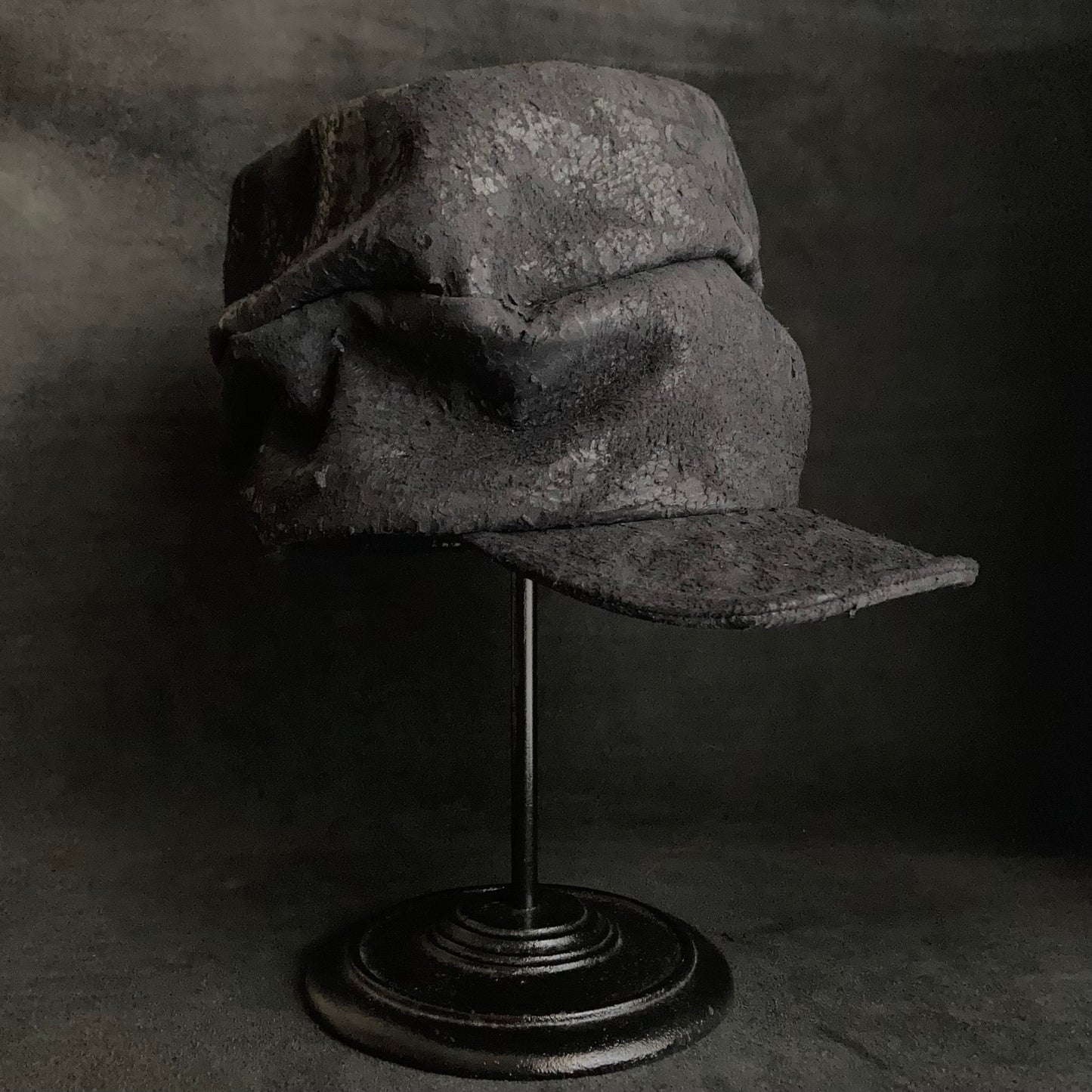 Scrape black leather turn cap