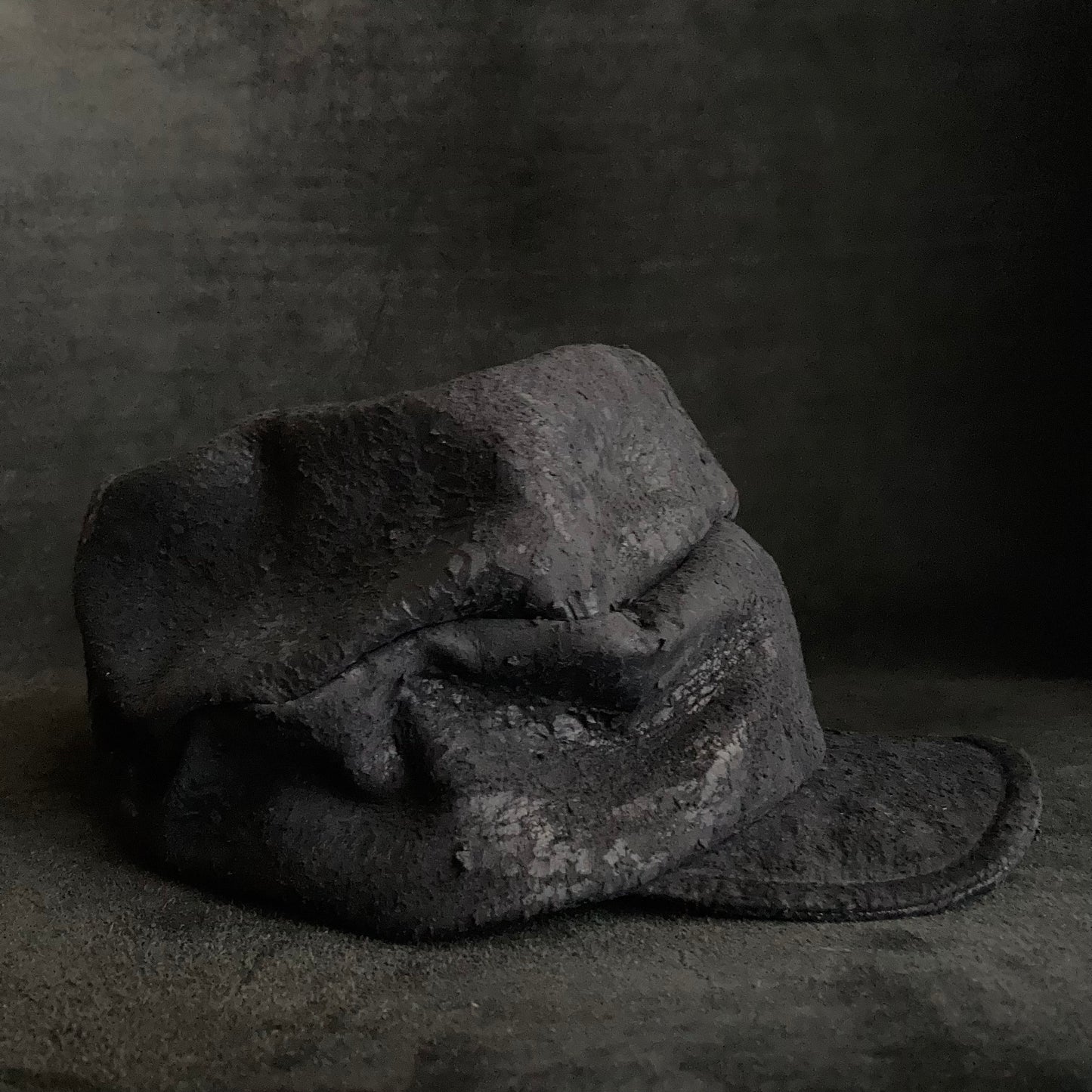 Scrape black leather turn cap