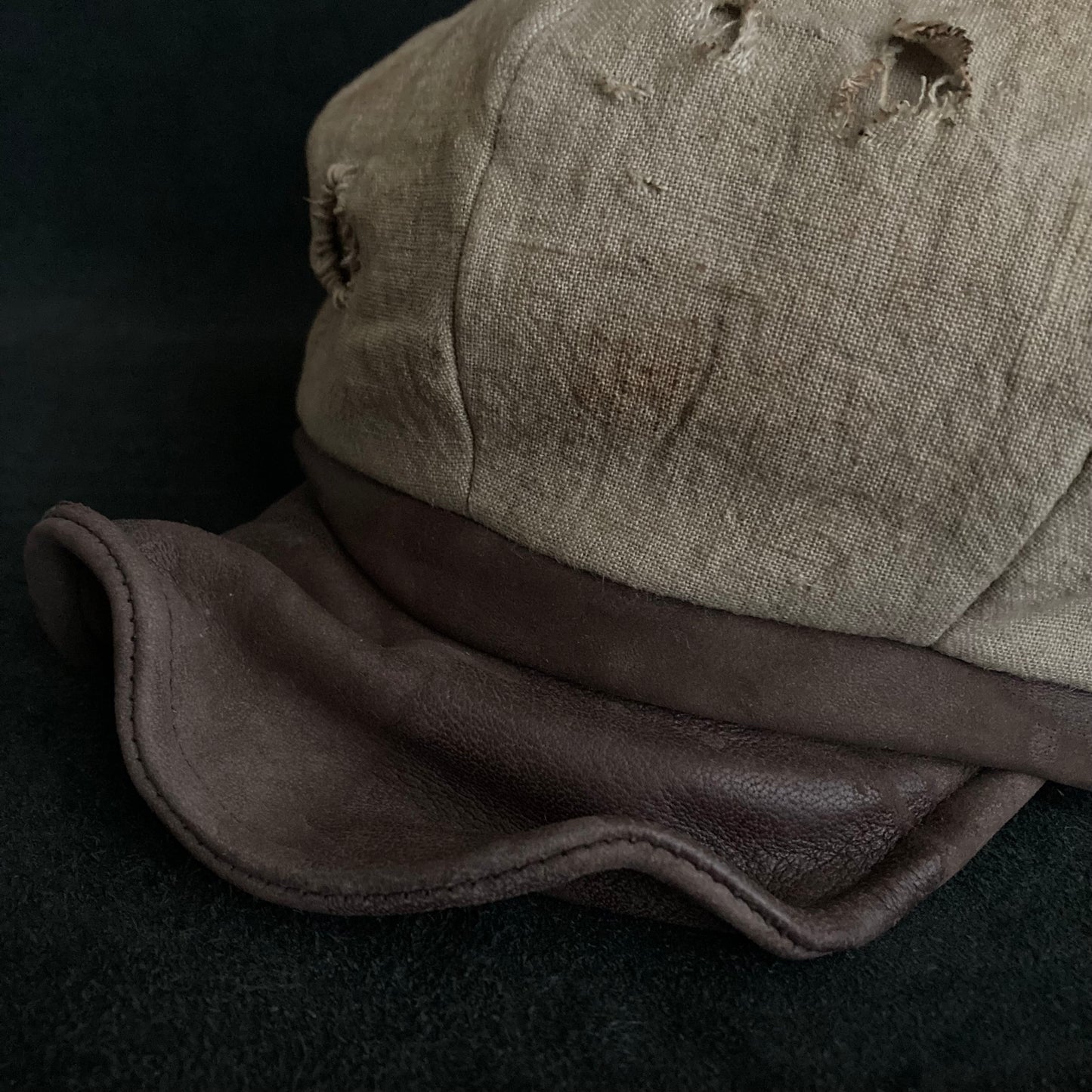 Sand tatters damage linen casquette